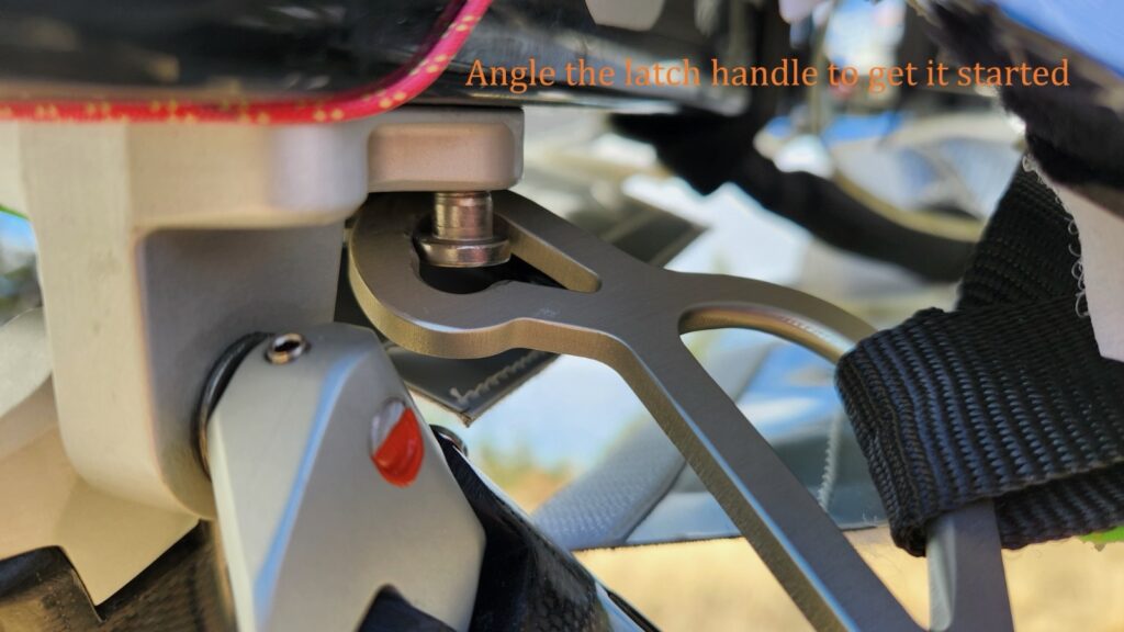 Photo: Angle the latch handle to get it started.